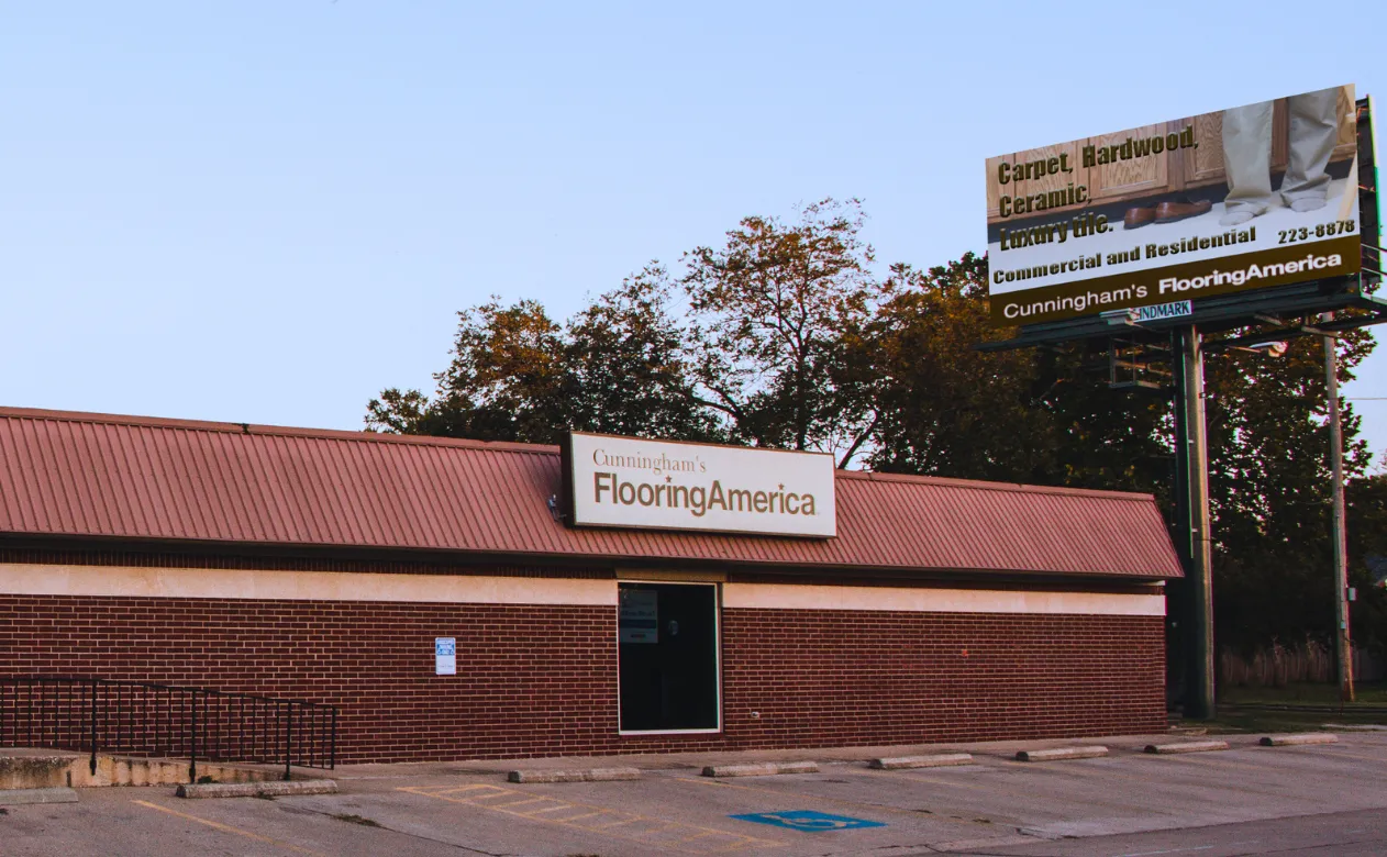 Cunningham's Flooring America's storefront and billboard.